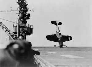 Accidents Prints: Douglas Dauntless dive bomber balanced on nose after crash landing on carrier flight deck