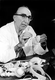 Surgeon Prints: Dr Michael DeBakey showing artificial heart at a news briefing in Houston