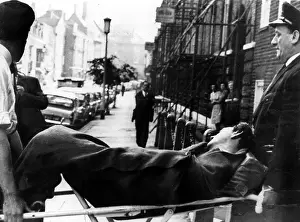 Unconscious Prints: Dr. Stephen Ward being carried from his home to an ambulance after taking an overdose of drugs