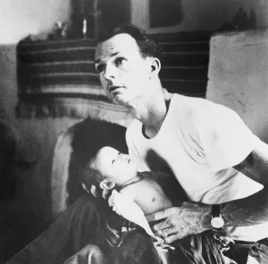 Vietnam Prints: Dr. Thomas A. Dooley (1927-1961) examining an ill child at a hospital in northern Laos