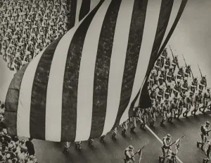 Stars And Stripes Prints: Dramatic photo of US flag and uniformed soldiers carrying rifles with bayonets fixed