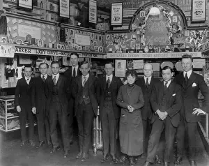 Employees Prints: Drug store, nine men and a woman posed in a drug store