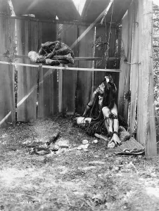 1910s Candid Prints: The drying mummy, Kwakiutl man inside board structure
