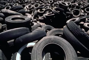 Environment Prints: Dump of discarded automobile tires that are to be burned creating a pollution smoke hazard