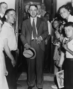 Mobster Prints: Dutch Schultz, emerging from doorway of Malone County jail