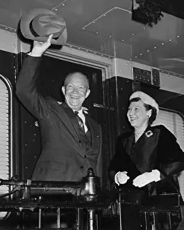 Couples Portraits Prints: Dwight and Mamie Eisenhower waving from the 1956 campaign train. - (BSLOC_2014_16_78)