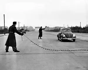 Chains Prints: East Berlin customs police stopping a Volkswagen on the Charlettenburger Chaussee with a tire puncturing heavy barbed