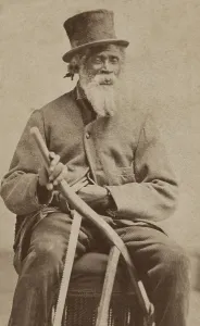 Overcoat Prints: Elderly African American man poses with a top hat