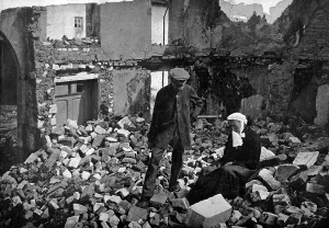 December Prints: An elderly French couple in the ruins of their home in a battle devastated area