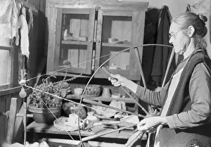 Hillbilly Prints: Elderly woman spinning yarn in her cabin near Gatlinburg