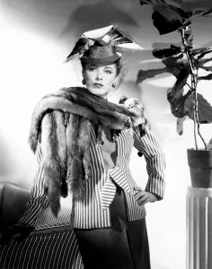 Eleanor Prints: Eleanor Parker, modeling a brown and pink ensemble with a sable scarf, 1945