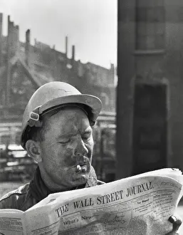 Skilled Laborers Prints: An electrician reads The Wall Street Journal to check his stock market investments