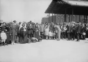 Frederick Prints: Ellis Island commissioner, Frederick Wallis posed with a group of new arrivals in 1921-21