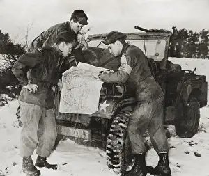 Jeep Prints: Elvis Presley and other soldiers read a map on maneuvers in Germany