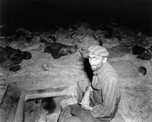 Starvation Prints: Emaciated Frenchman sitting among the dead in prison camp