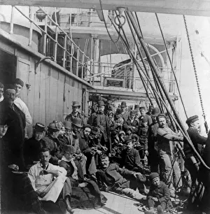 Voyages Prints: Emigrants on the crowded lower deck of a steamship, crossing the Atlantic Ocean. Ca. 1890
