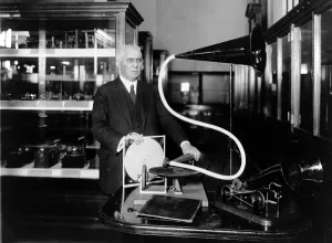 Phonograph Prints: Emile Berliner with the model of the first phonograph machine which he invented c. 1920