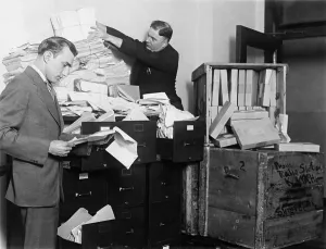 Mail Prints: Two employees of the Federal Radio Commission overwhelmed by piles of mail in 1929