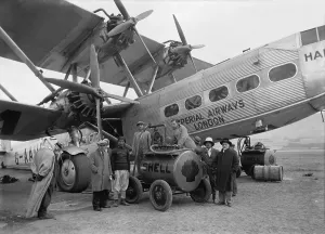 Israel Prints: Four engine passenger plane of the Imperial Airways refueling from a Shell Oil Company mobile fuel tank at Semakh