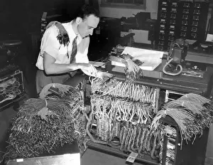 Engineers Prints: A engineer works on a IBM computer used to administer the Gl insurance dividend for millions of veterans