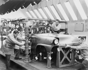 Engineers Prints: Engineers assembling a proto-type of the a Ford Motor Company auto