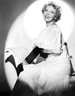 Landi Prints: ENTER MADAME, Elissa Landi (modeling a white mousseline frock with brown velvet bow and gloves)