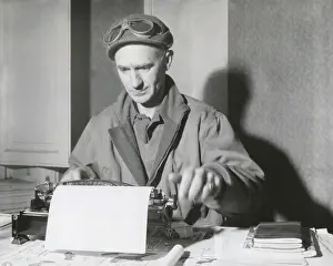 Ernie Prints: Ernie Pyle, war correspondent, at his typewriter while reporting from the Anzio Beachhead