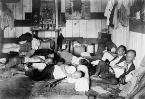 Pigtails Prints: Ethnic Chinese smoking in an opium den in Manila, Philippine. 1924