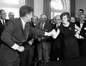 Social Programs Prints: Eunice Shriver receives a signing pen from her brother