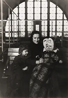 Ellis Island Prints: European immigrant mother with two young children at Ellis Island, c. 1908