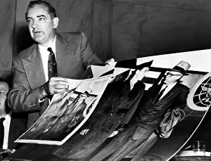 Catalog Images Prints: EV1816 - Senator Joseph McCarthy showing a cropped photo that he claims is 'evidence' of American Communist