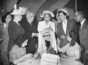 Sewing Prints: Eva Peron visiting a sewing workshop where women workers were engaged in embroidery