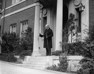 Ex Presidents Prints: Ex-President Woodrow Wilson (1856-1924) standing on the porch of his Washington DC home on April 28