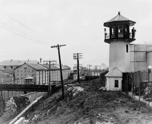 Penitentiary Prints: Exterior view of Sing Sing Prison in Ossining New York showing guard tower and cell block