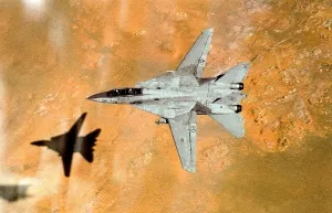F-14 Tomcat aircraft passes over western Saudi Arabia during low-altitude flight from the aircraft carrier USS THEODORE ROOSEVELT. Apr 1 1991. (BSLOC_2011_12_1)