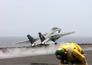 War On Terrorism Prints: F-14 Tomcat fighter launches from the flight deck of the aircraft carrier USS John F