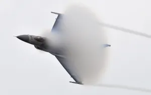 Jets Prints: F-16 Fighting Falcon creates a vapor cone of condensation as it nears Mach 1 the speed of sound at Volk Field Air