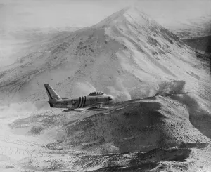 Air Force Prints: F-86 Sabre Jet against a rugged