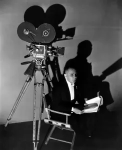 Script Prints: THREE FACES EAST, Erich von Stroheim awaits his cue, on-set, 1930