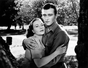 Images Dated 18th April 2013: THREE FACES WEST, from left, Sigrid Gurie, John Wayne, 1940