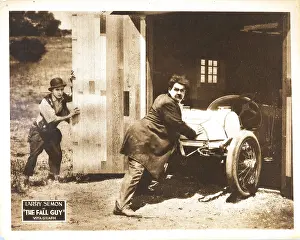 Hardy Prints: THE FALL GUY, lobbycard, from left: Larry Semon, Oliver Hardy, 1921
