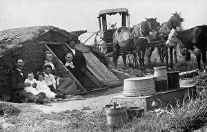 Migration Prints: Two families posing in front of an Oklahoma dugout home share the novelty of having their picture taken