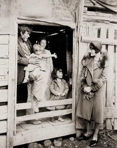Contrast Prints: A family of poor sharecroppers at their Arkansas farm home welcome a Red Cross worker during the great drought of
