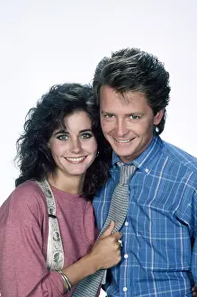 1980s Hairstyles Prints: FAMILY TIES, from left, Courteney Cox, Michael J. Fox, 1982-89 (1987 photo)