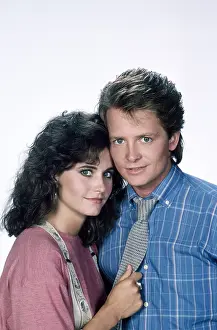 1980s Hairstyles Prints: FAMILY TIES, from left, Courteney Cox, Michael J. Fox, 1982-89 (1987 photo)