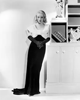 Orry Kelly Prints: FASHIONS OF 1934, Bette Davis (in a gown by Orry-Kelly), 1934