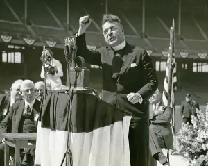 Depression Prints: Father Coughlin (1891-1979), Father Coughlin addresses large Cleveland rally with right fist raised