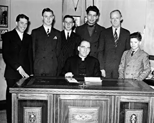 Nebraska Prints: Father Edward Flanagan proudly sits on his desk made by Boys Town citizens over a period of three years