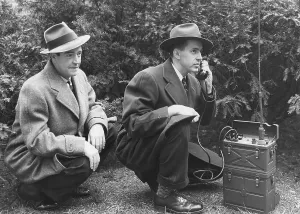 Kidnapping Prints: FBI agent with an huge portable phone during a kidnapping stakeout. Ca. 1940s