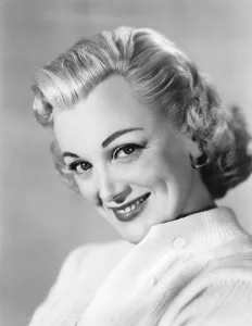 Thick Eyebrows Prints: FEMALE ON THE BEACH, Jan Sterling, 1955